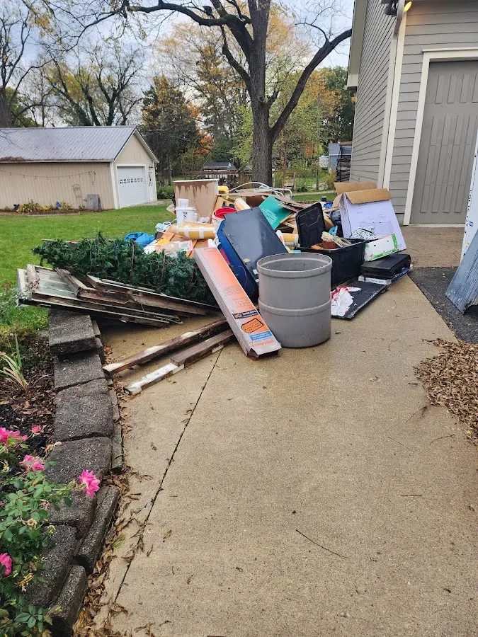 Dumpster being loaded with debris for 3 Yard Dumpster Rental in Edinburgh